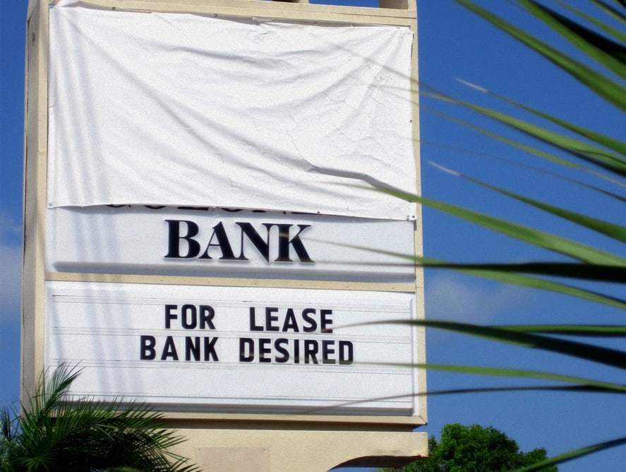 Bank Sign with For Lease Notice Representing How Cash Recyclers Can Optimize Bank Trips