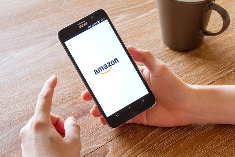 Cellphone with Amazon Logo Representing Amazon Cash Partners and Tidel Cash Management Solutions